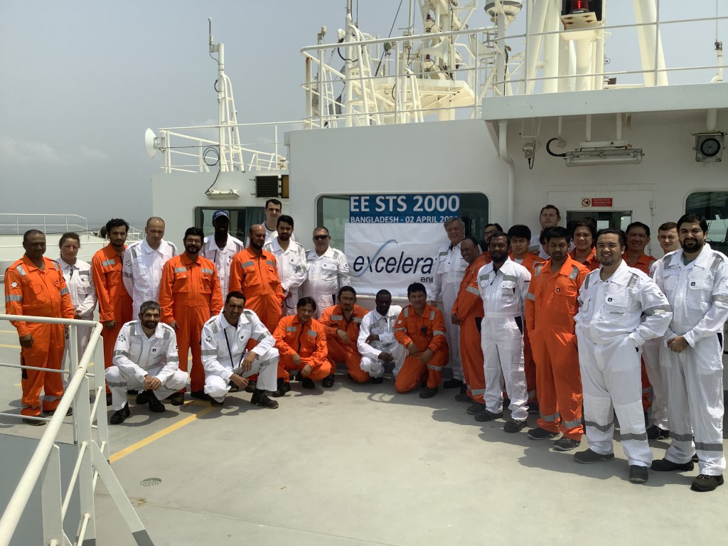 Crew of FSRU Excellence at MLNG celebrating Excelerate's 2000 STS of LNG