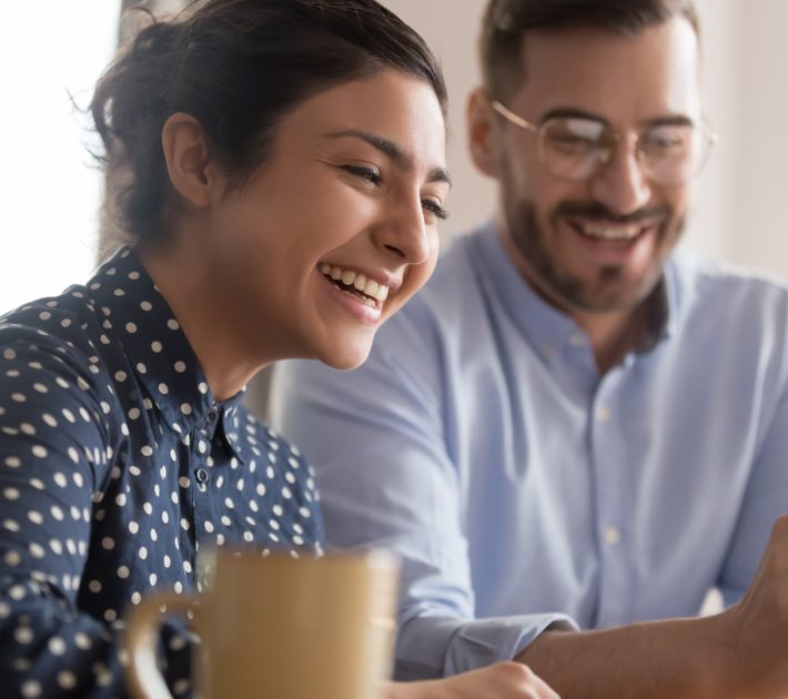 Employees smiling at a meeting